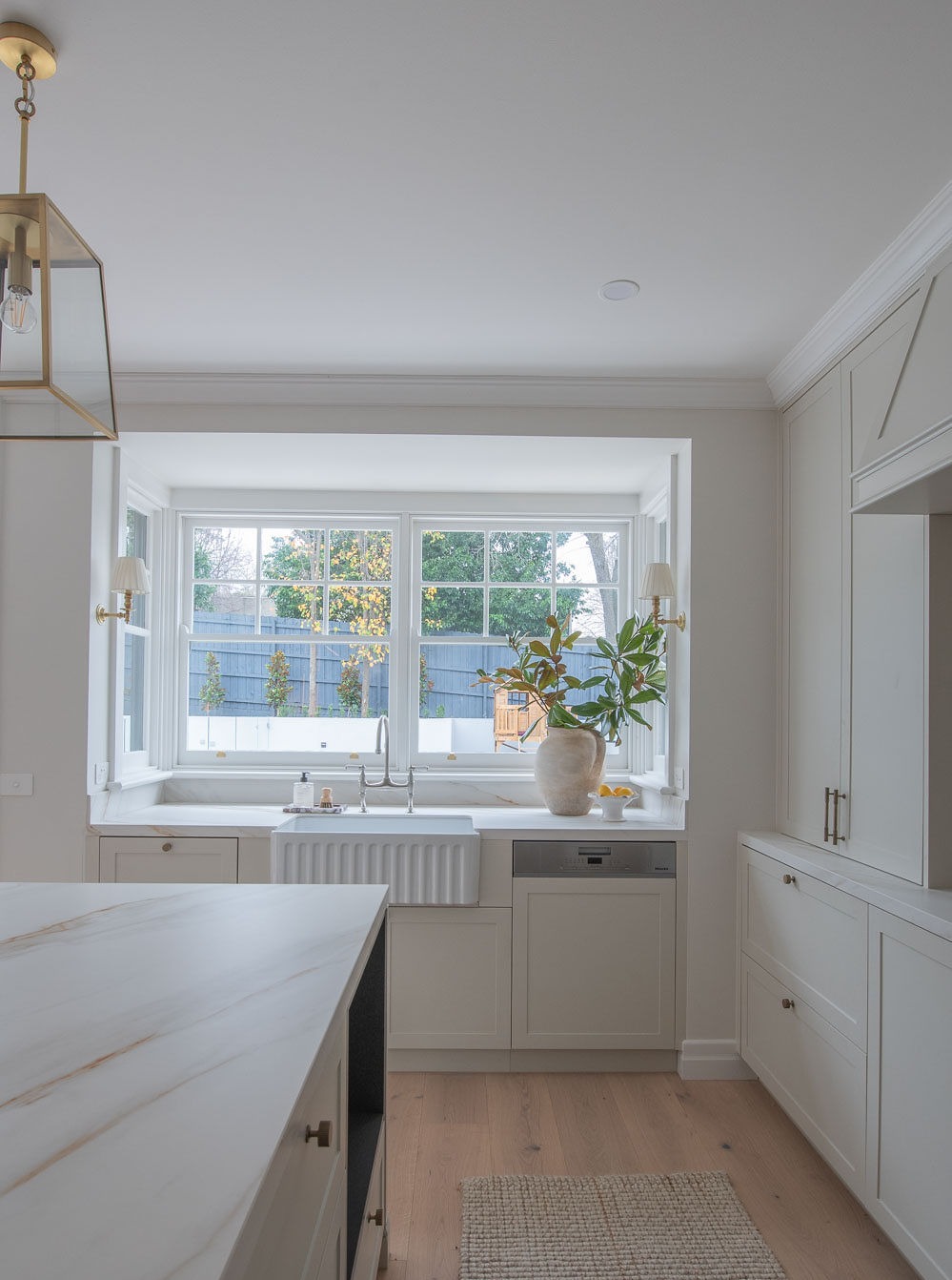 The farmhouse sink beneath the window